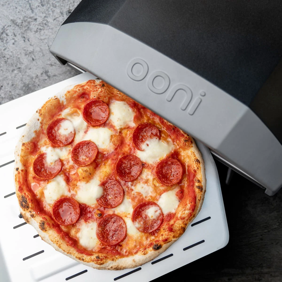 Ooni "Koda 12" Gas Powered Pizza Oven Ooni "Koda 12" Gas Powered Pizza Oven -Traeger Pellet Grills OoniKoda TopPizza1 1200x1200 5c42ca28 4c7c 4d71 b1af 8421e3491d53